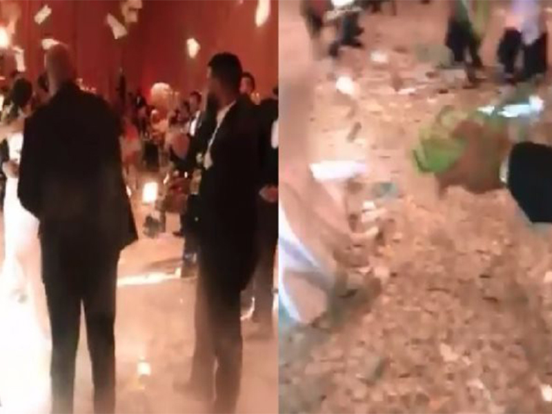 اضغط لمشاهدة الفيديو: أمطار من الدولارات "نقوط" عروسين يوم زفافهما!